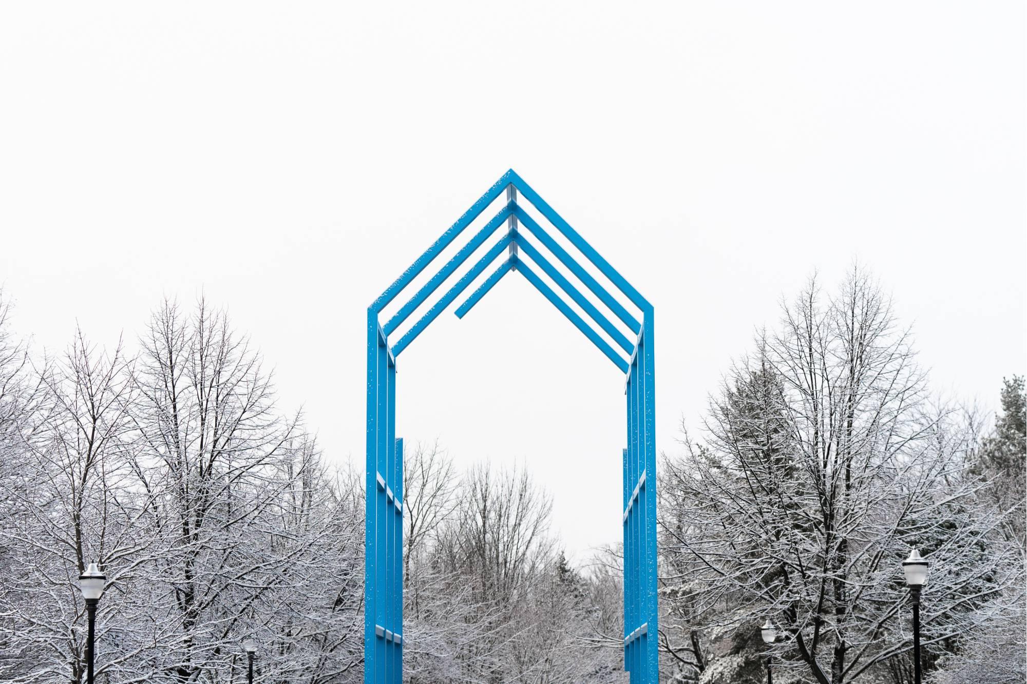 The blue Transformational Link on GVSU's Allendale Campus in the winter with snow on the ground